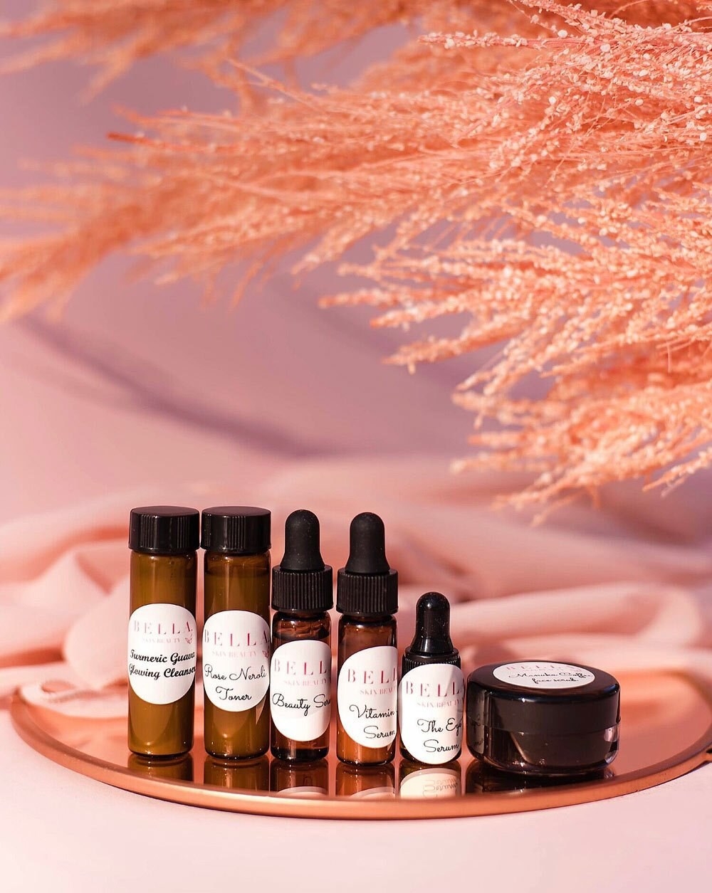 the face sampler set on a rose gold tray