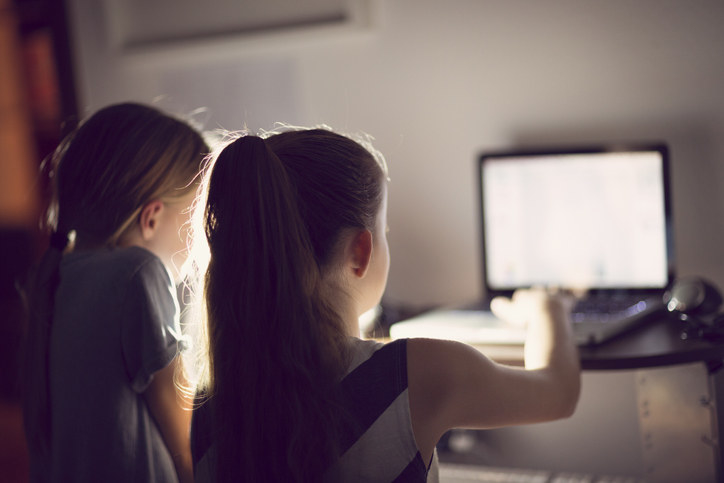 kids looking at a computer