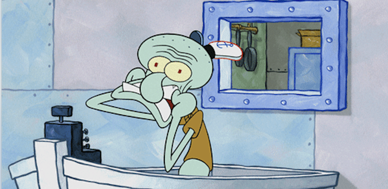 Squidward having a breakdown behind the register