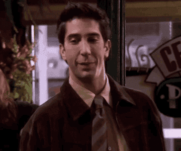 Ross Gellar, from the show Friends, smiles, revealing blindingly white teeth.