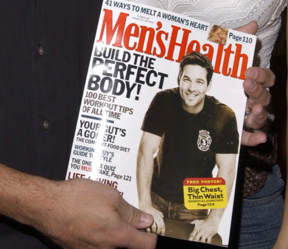 Eddie Cibrian holding a Men&#x27;s Health issue with him on the cover