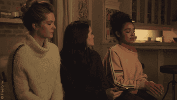 Gif of Sutton and Jane watching Kat shimmy