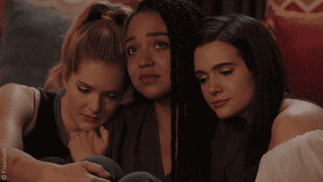 Gif of Sutton and Jane consoling Kat as she cries