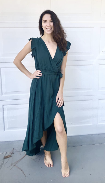 reviewer wearing green dress