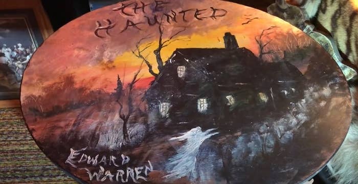 Table art of a house and ghost painted and signed by Edward Warren