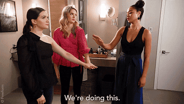 Gif of the girls in a group huddle saying, &quot;We&#x27;re doing this.&quot; 