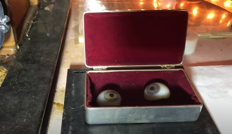 Two fake eyes inside a small container
