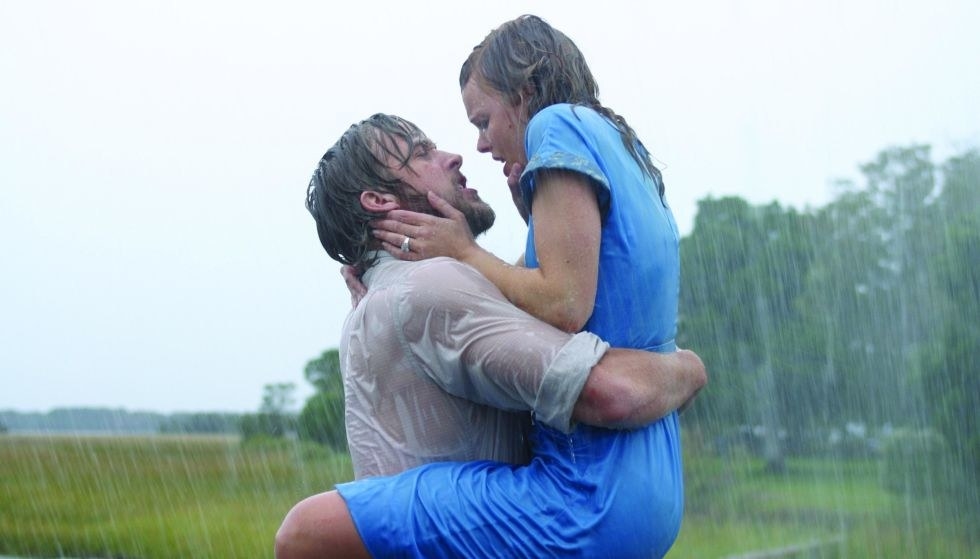 a couple embracing and passionately kissing in the rain