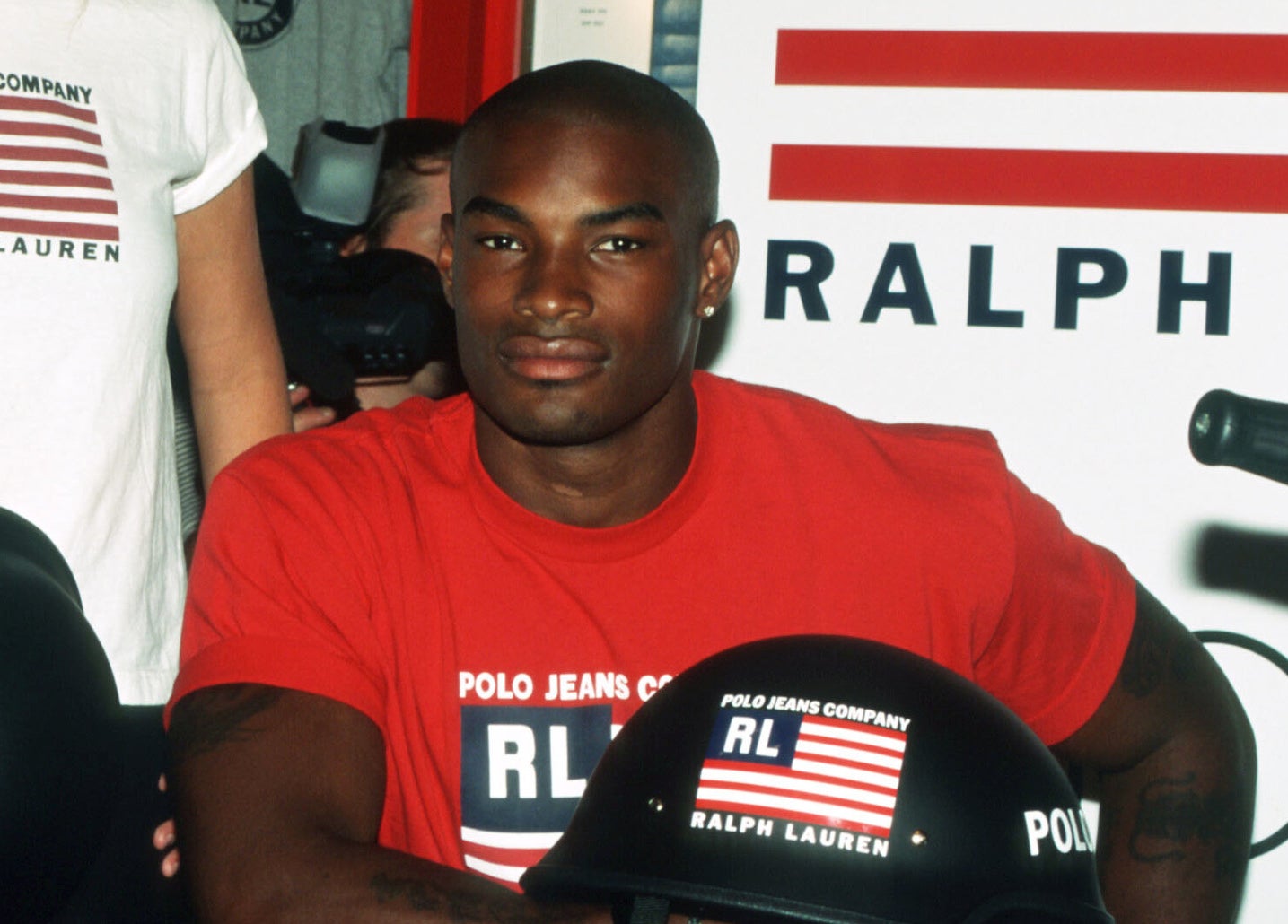 Tyson Beckford in a red Polo Jeans T-shirt at an in-store event for Polo