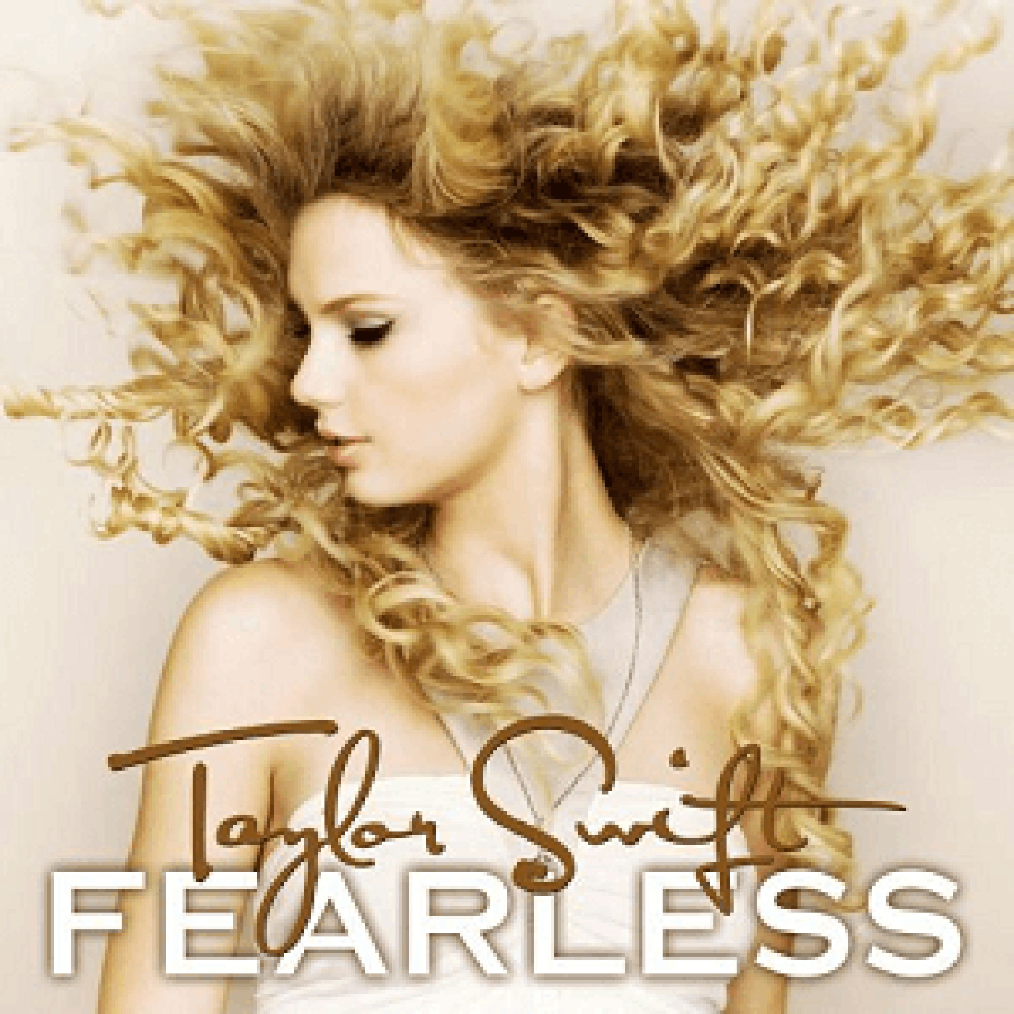 Fearless album cover, taylor swift looks down and her curly hair flies about her head