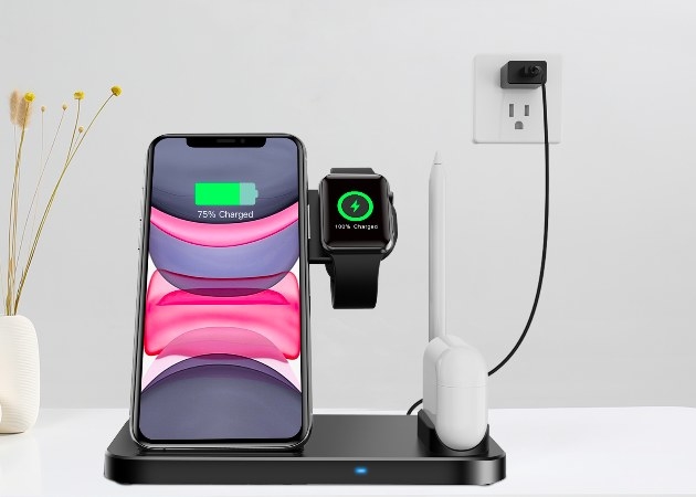 The charging station shown charging an Apple IPhone, watch, and airpods