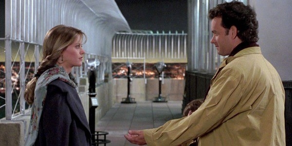 the couple from sleepless in seattle on top of a building, being romantic