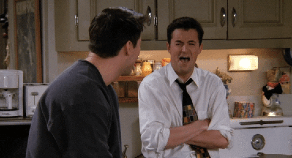 Chandler and Joey laughing hysterically on Friends