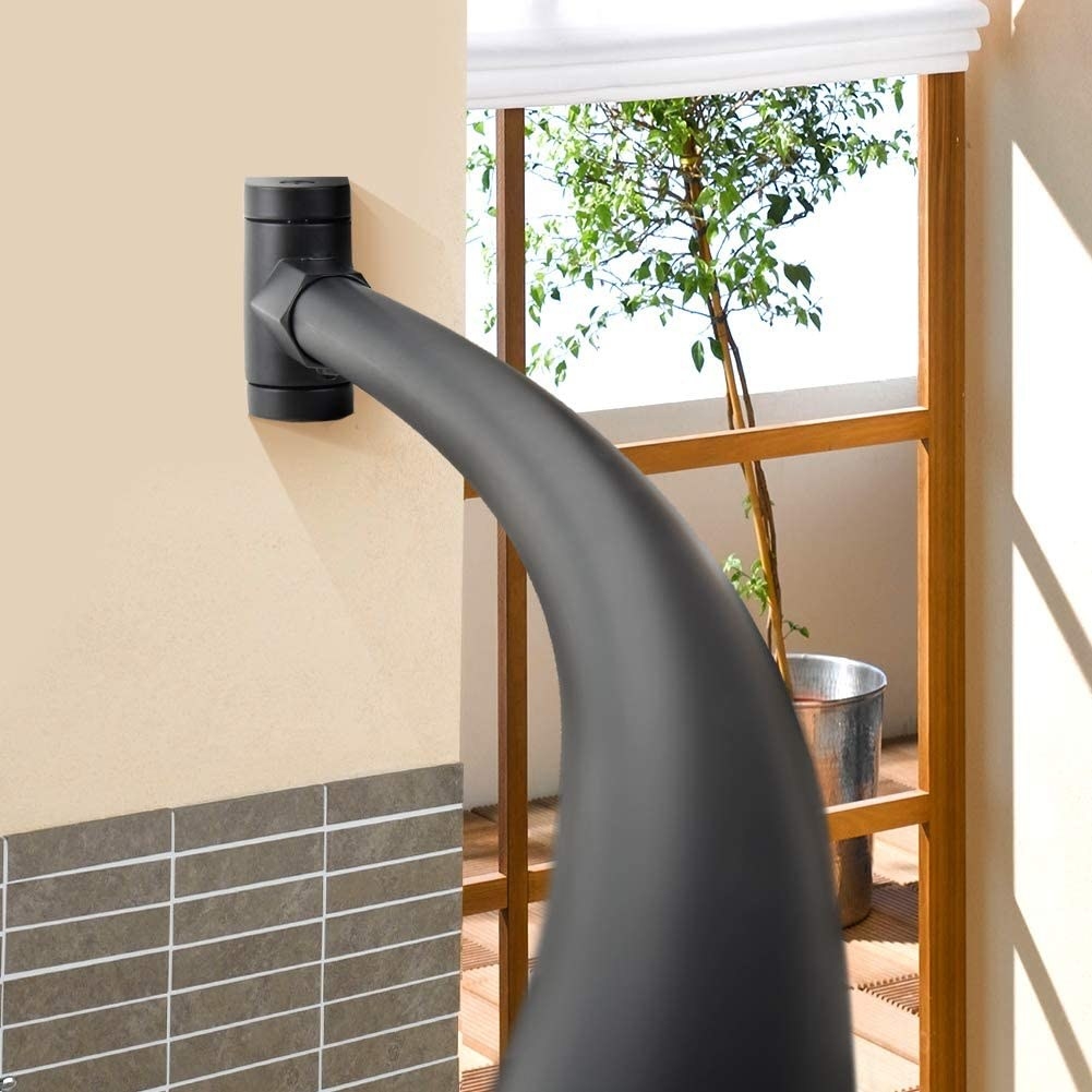 A curved shower rod in a bathroom