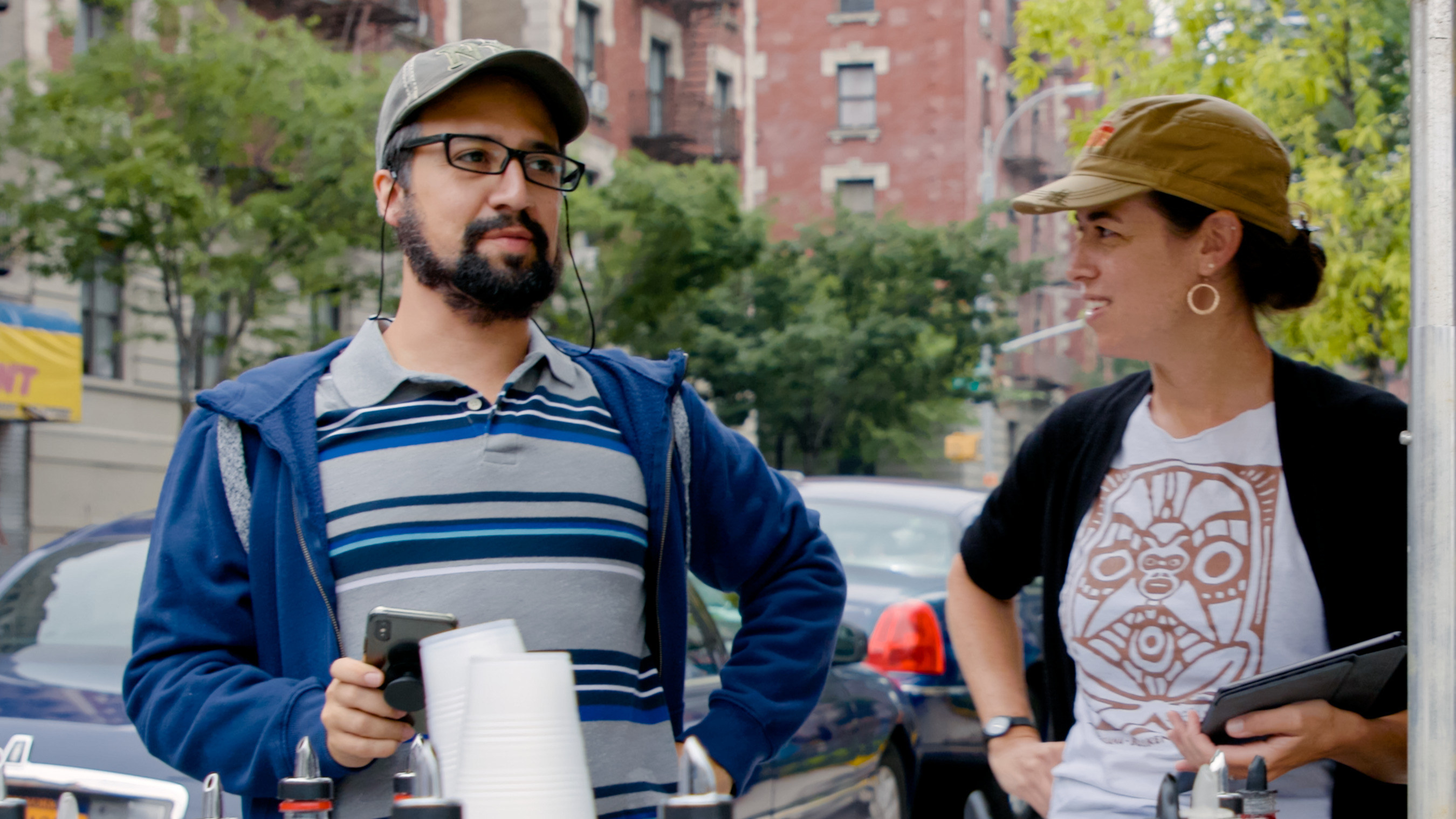 Lin and Quiara talking on the set of In The Heights