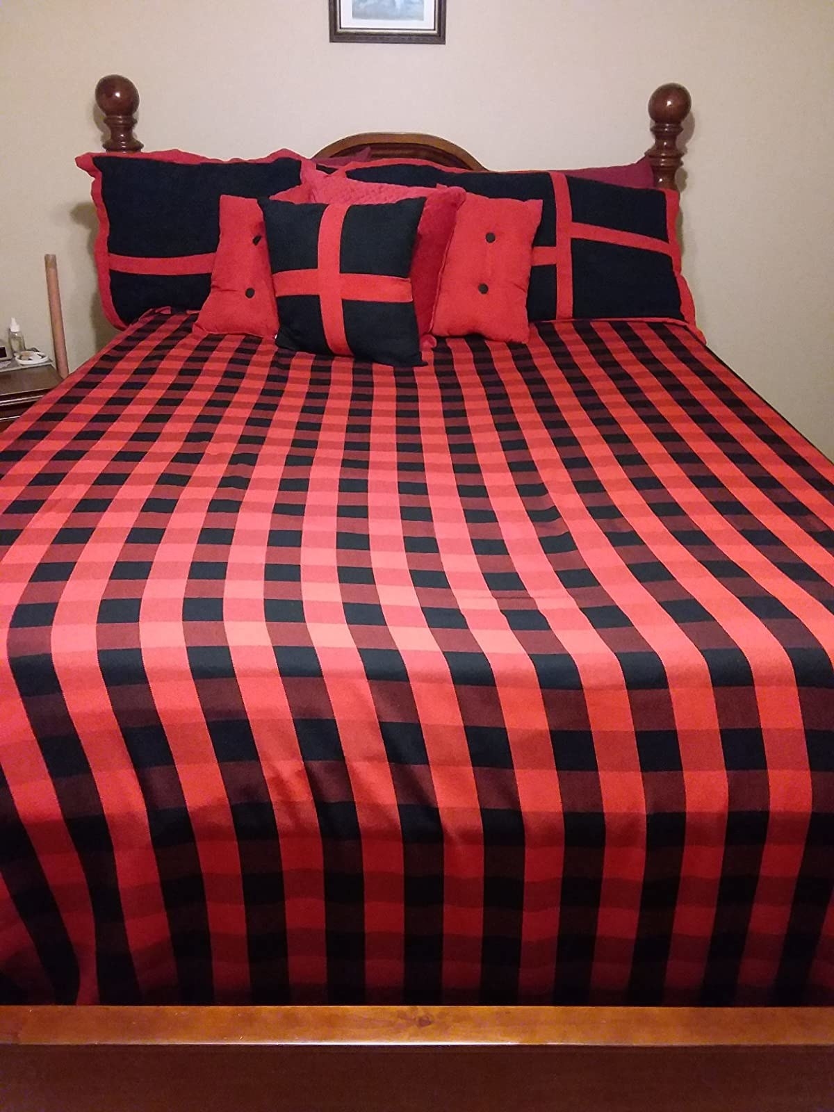 The red and black check blanket on a reviewer&#x27;s bed