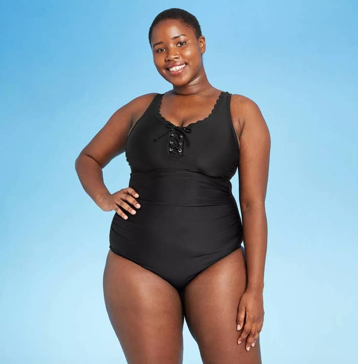 model wearing the black swimsuit