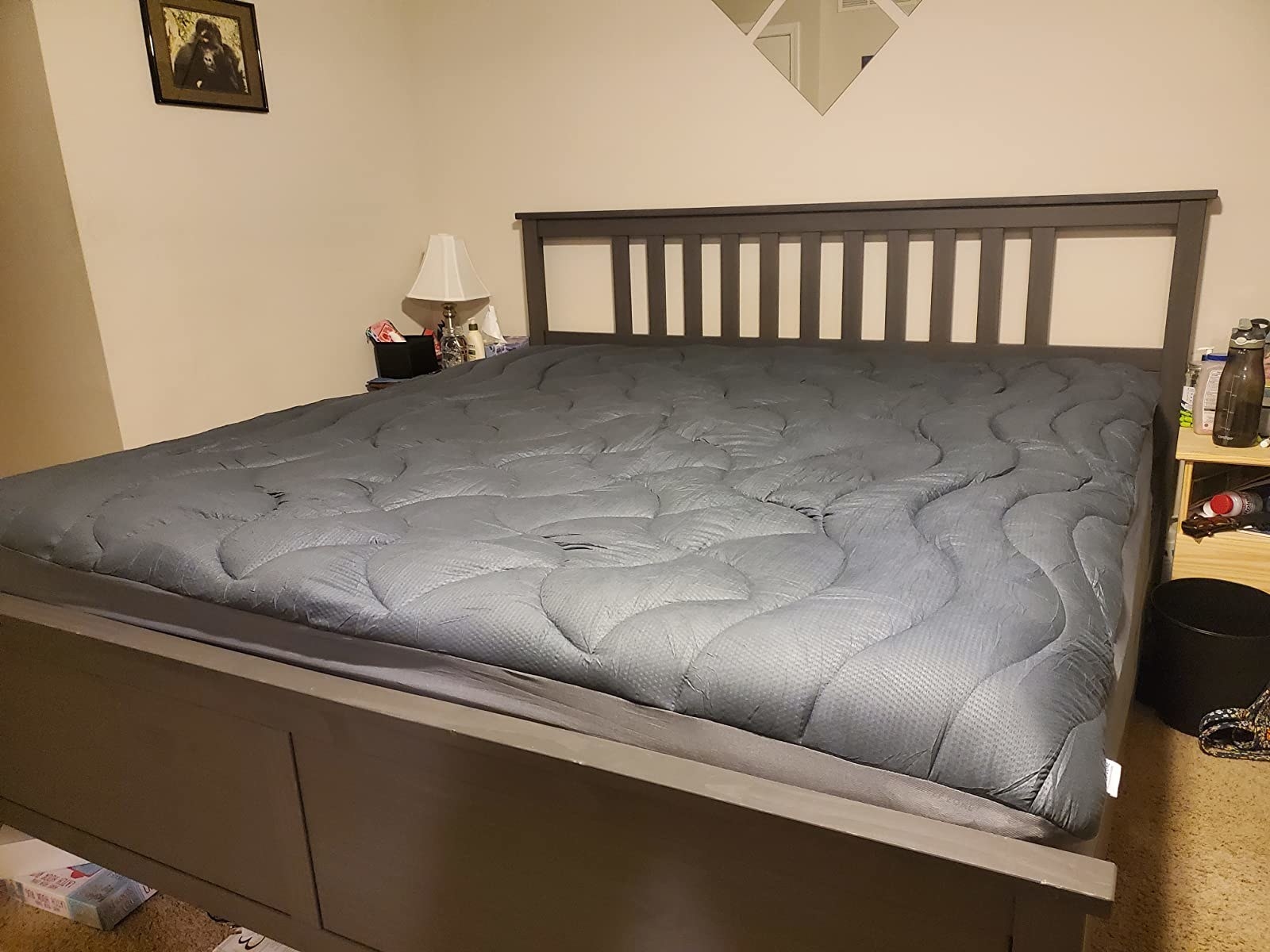 The mattress topper on a reviewer&#x27;s bed