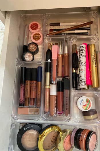 reviewer's makeup drawer with clear bins organizing it