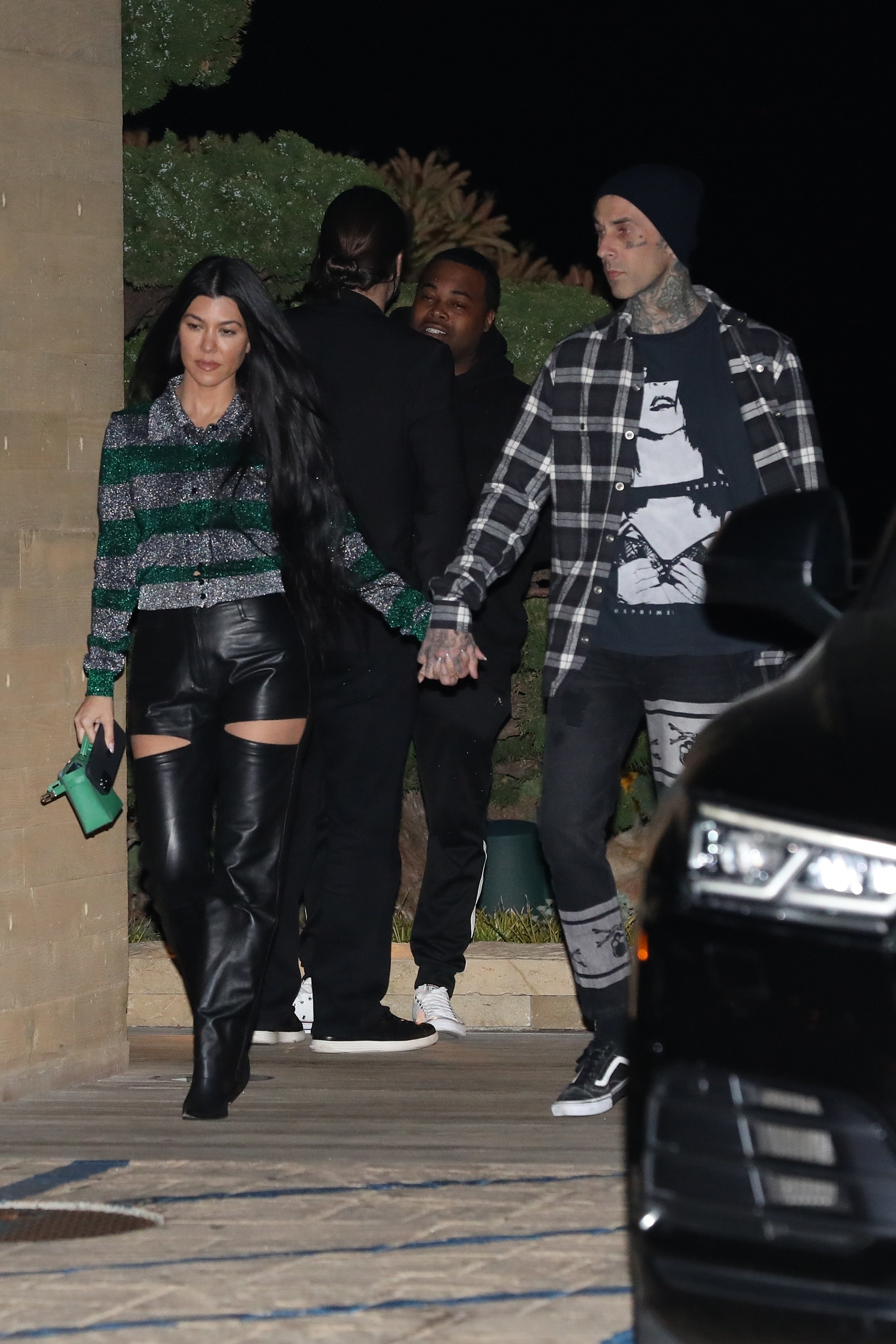 Kourtney Kardashian and Travis Barker are seen at Nobu restaurant on March 20, 2021 in Malibu, California