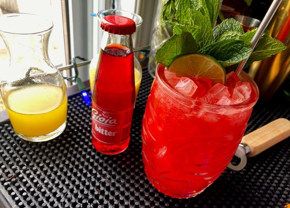 Virgin junglebird cocktail with fresh juice and bitter soda to the side.