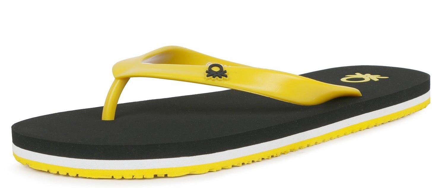 A singular UCB flip flop in black, yellow, and white.