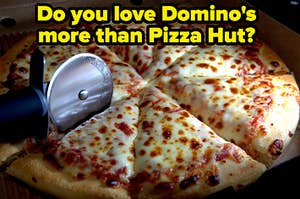 A cheese pizza is in a box, being sliced with a label that reads: "Do you love Dominos more than Pizza Hut?"
