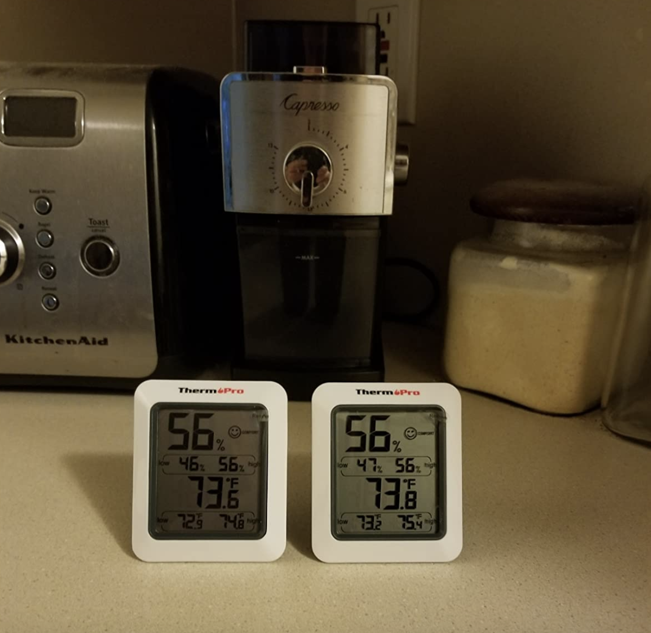 two of the thermometers next to each other on a kitchen counter