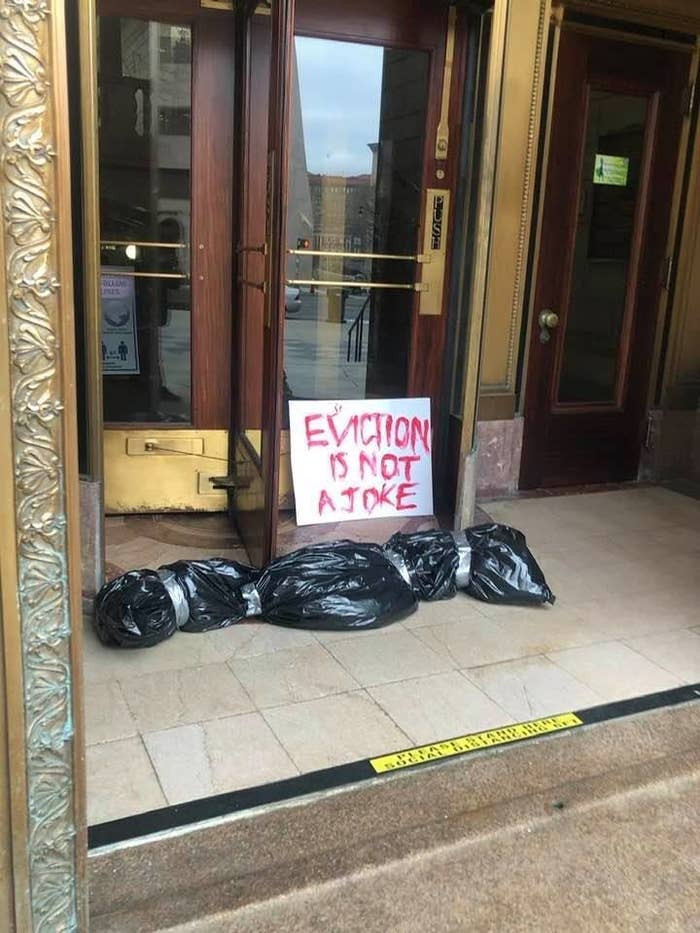 Fake Body Bag placed at Hartford City Hall 4/1/21 with a sign reading "Eviction is not a joke."