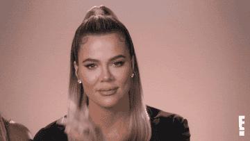 Khloé Kardashian gestures like she&#x27;s about to keep her mouth shut