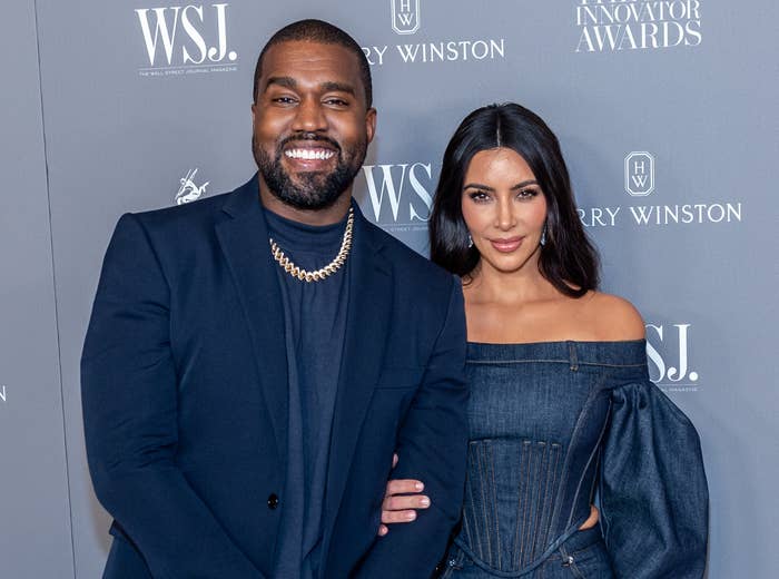 Kim and Kanye smile on a red carpet in happier times