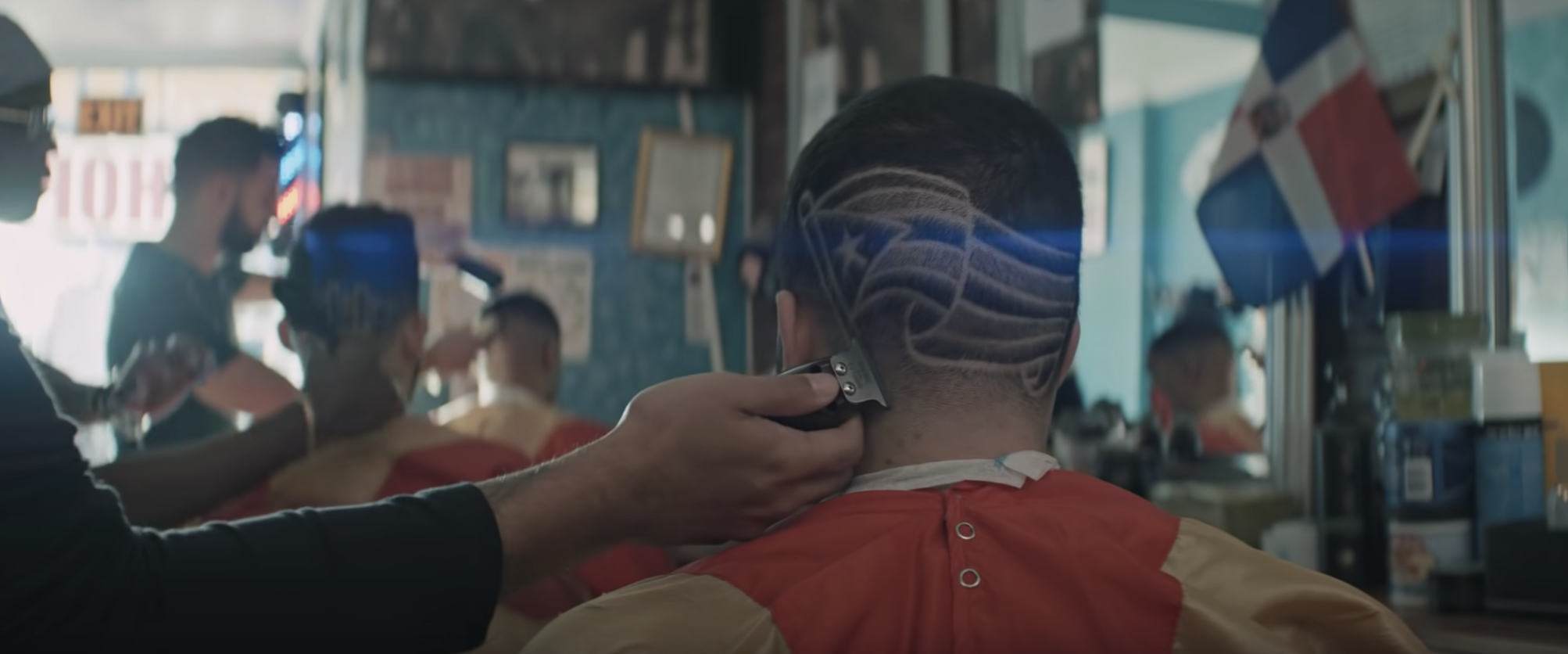 A Puerto Rican flag shaved onto the head of a man in In The Heights