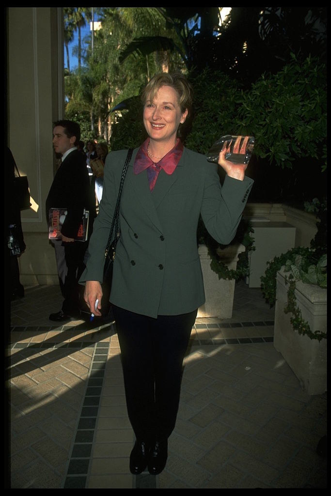 Meryl rocking a pantsuit as she waves at the Women in Hollywood Awards