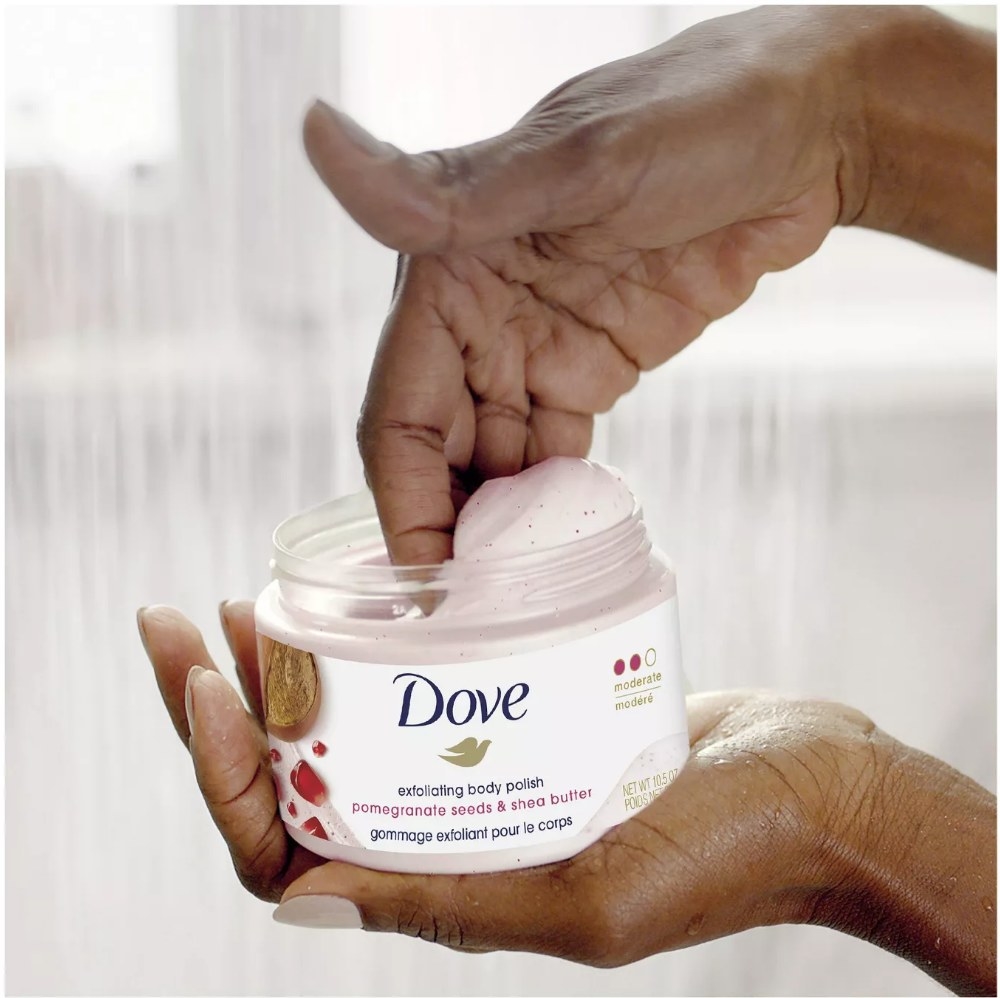 A model using Dove exfoliating body polish with pomegranate seeds and shea butter