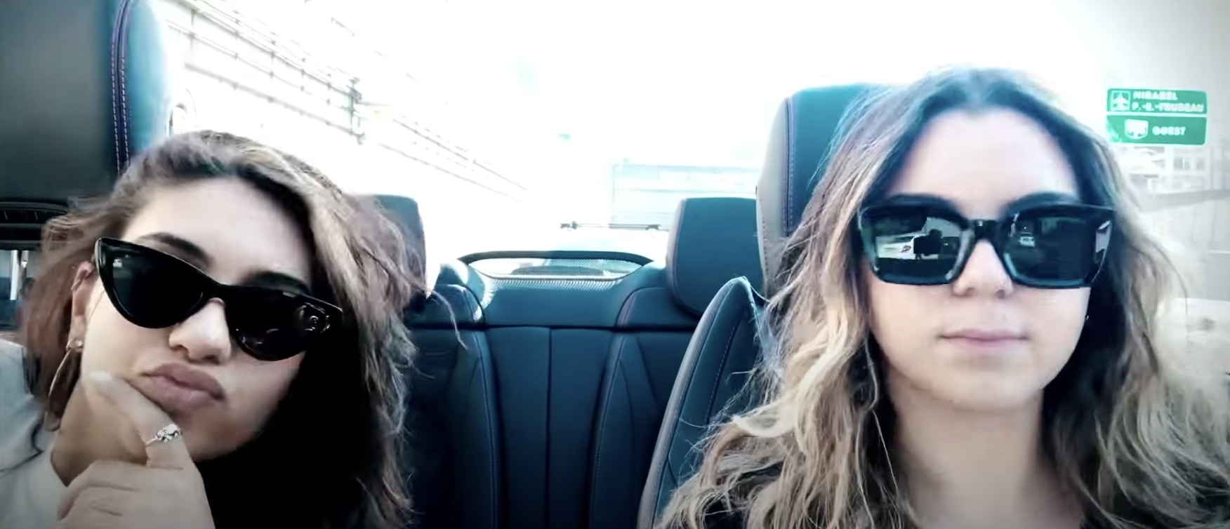 Alessia and her friend in the car with sunglasses on