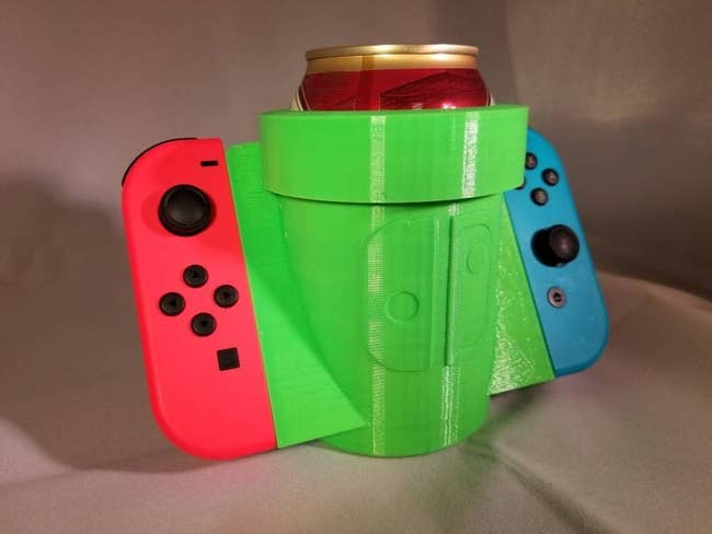 can holder with area on either side to clip in switch controllers