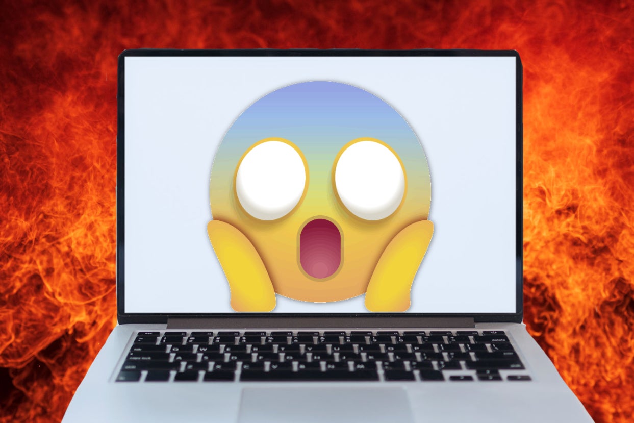 Gasping emoji over a laptop that's surrounded by fire