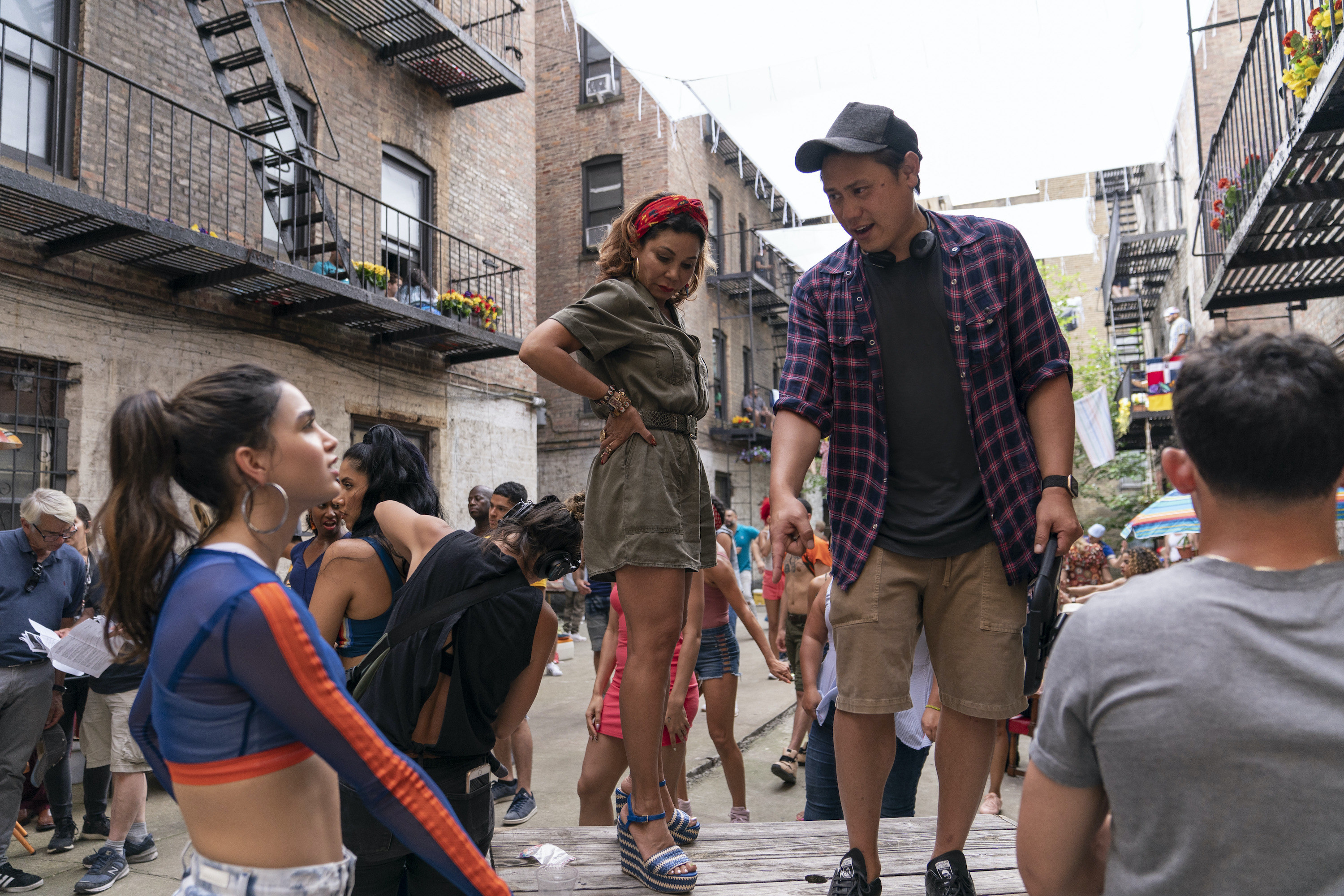 Jon giving direction to Melissa Barrera on set of In The Heights