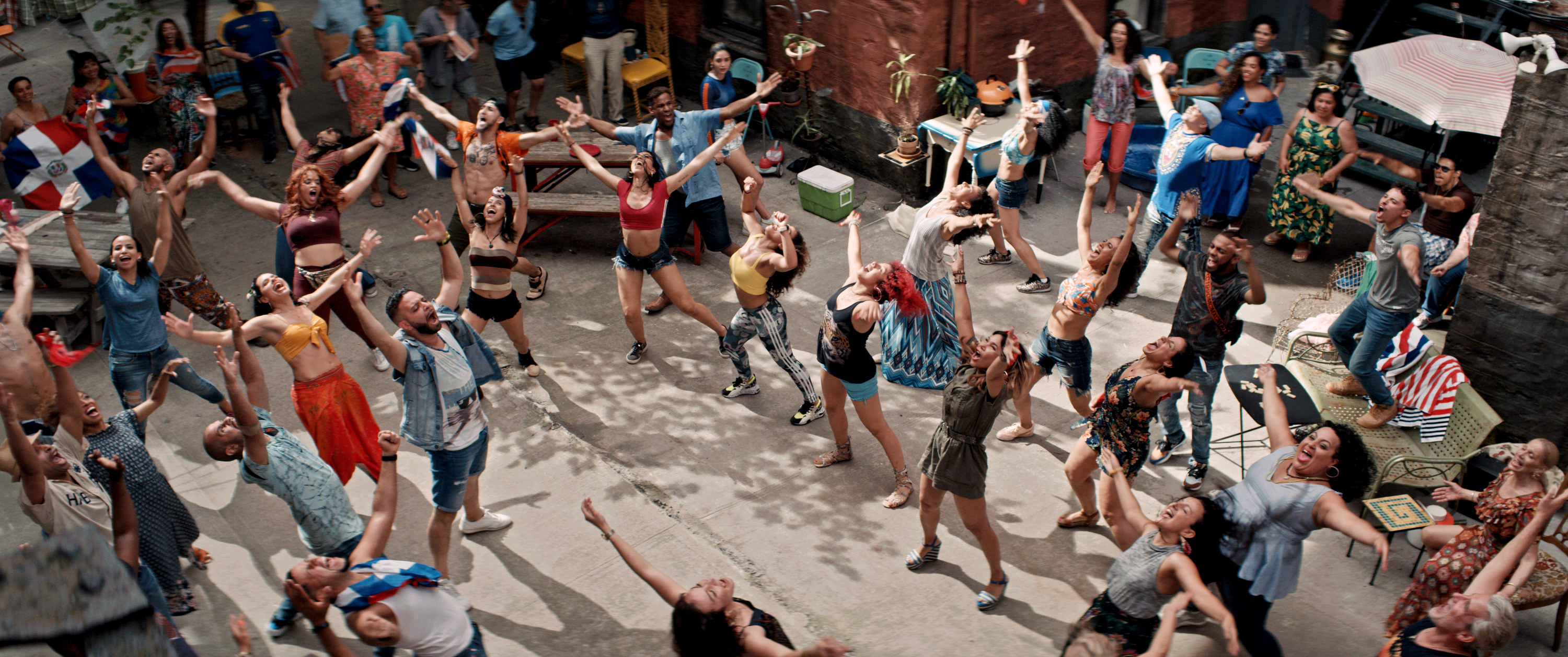 People dancing during Carnaval del Barrio in the film