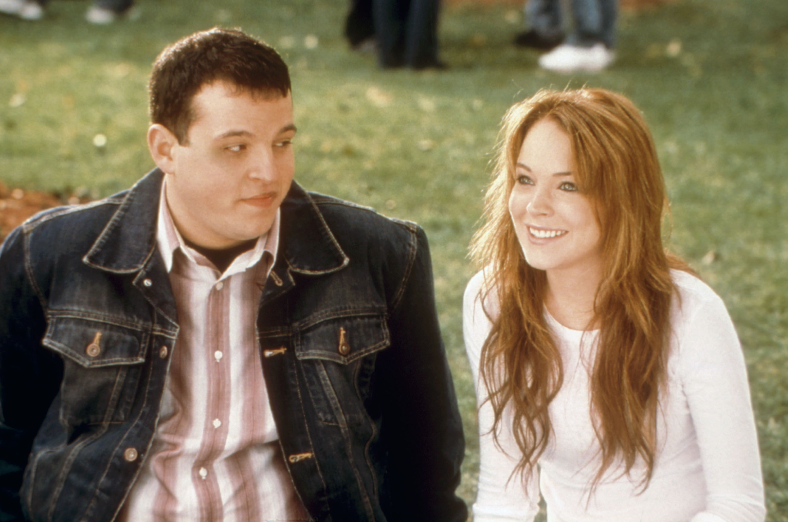 Daniel Franzese and Lindsay Lohan sit on the lawn