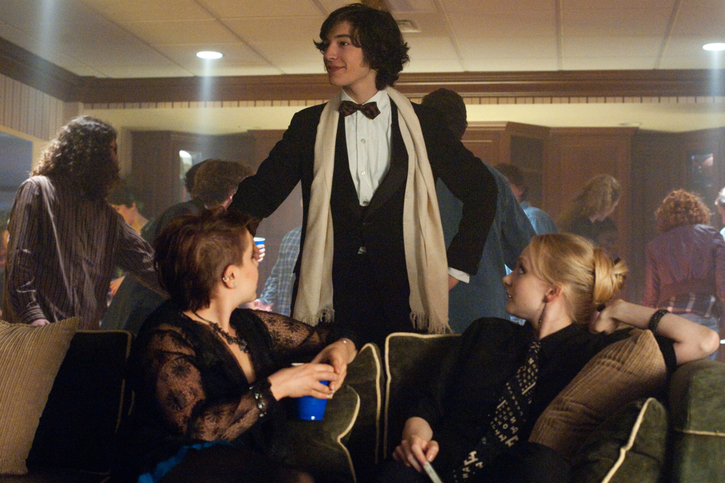 Ezra Miller presides over Mae Whitman and Erin Wilhelmi at a party