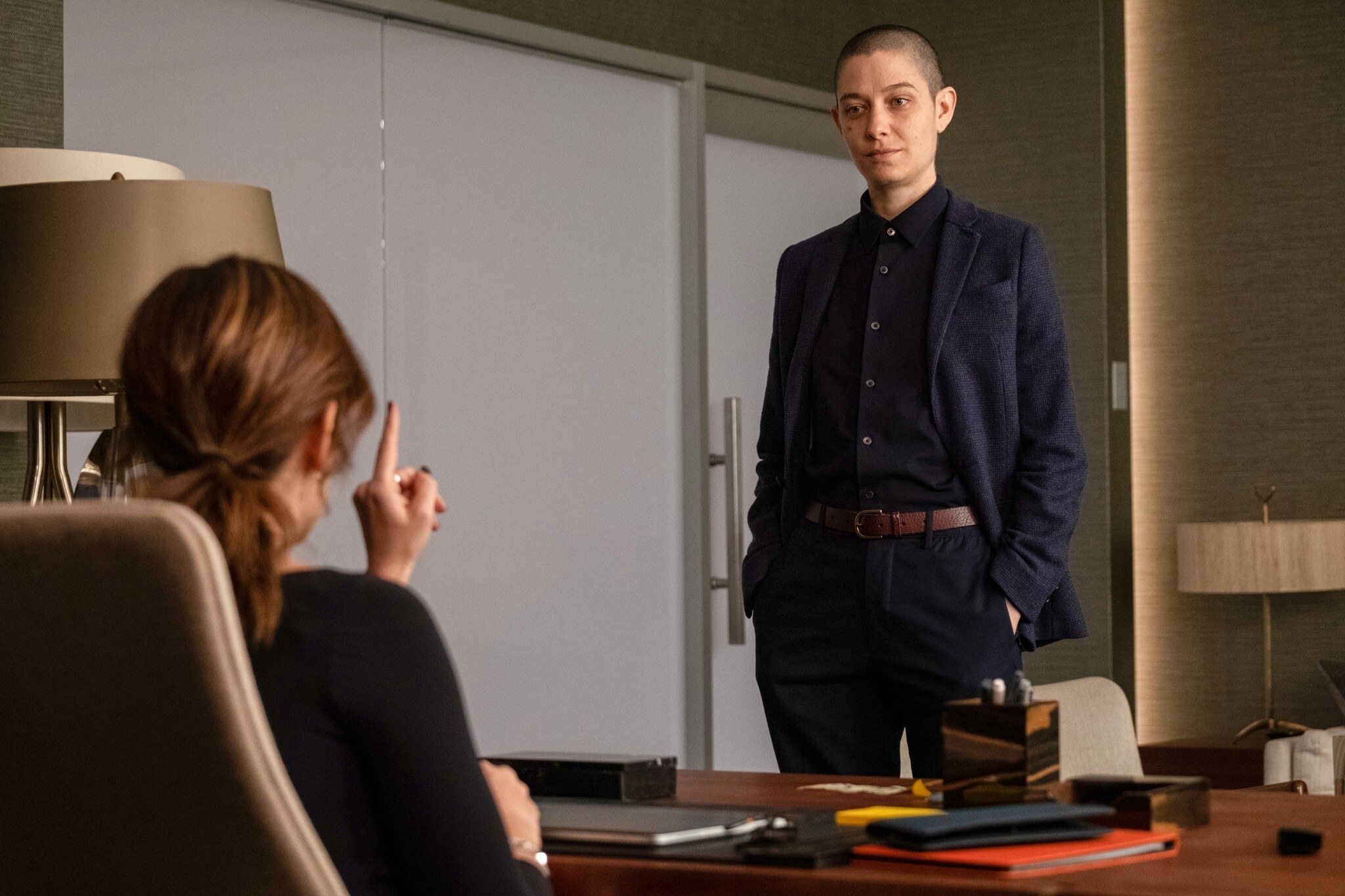 Asia Kate Dillon stands in front of Maggie Siff&#x27;s desk