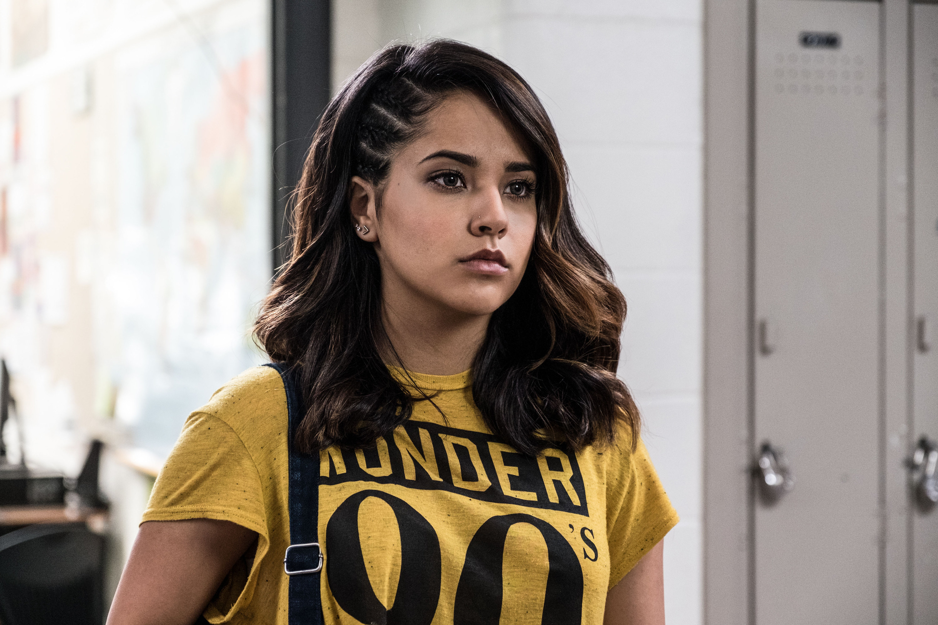 Becky G in a yellow T-shirt