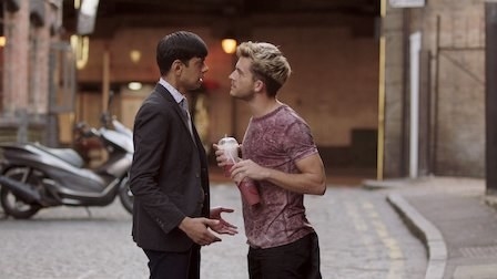 Amit Shah and Jonathan Bailey talk in an alleyway