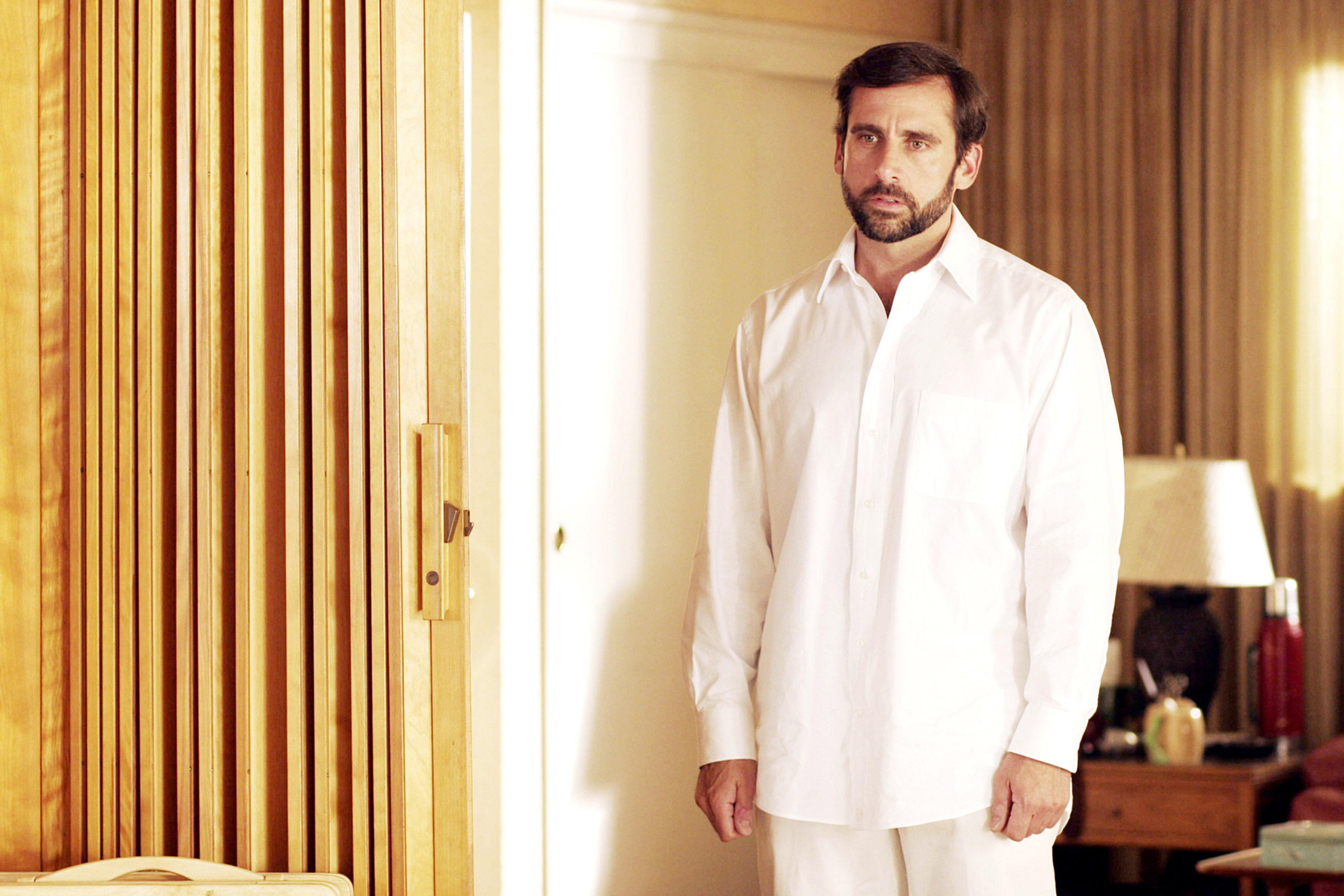 Steve Carell, all in white, looking depressed