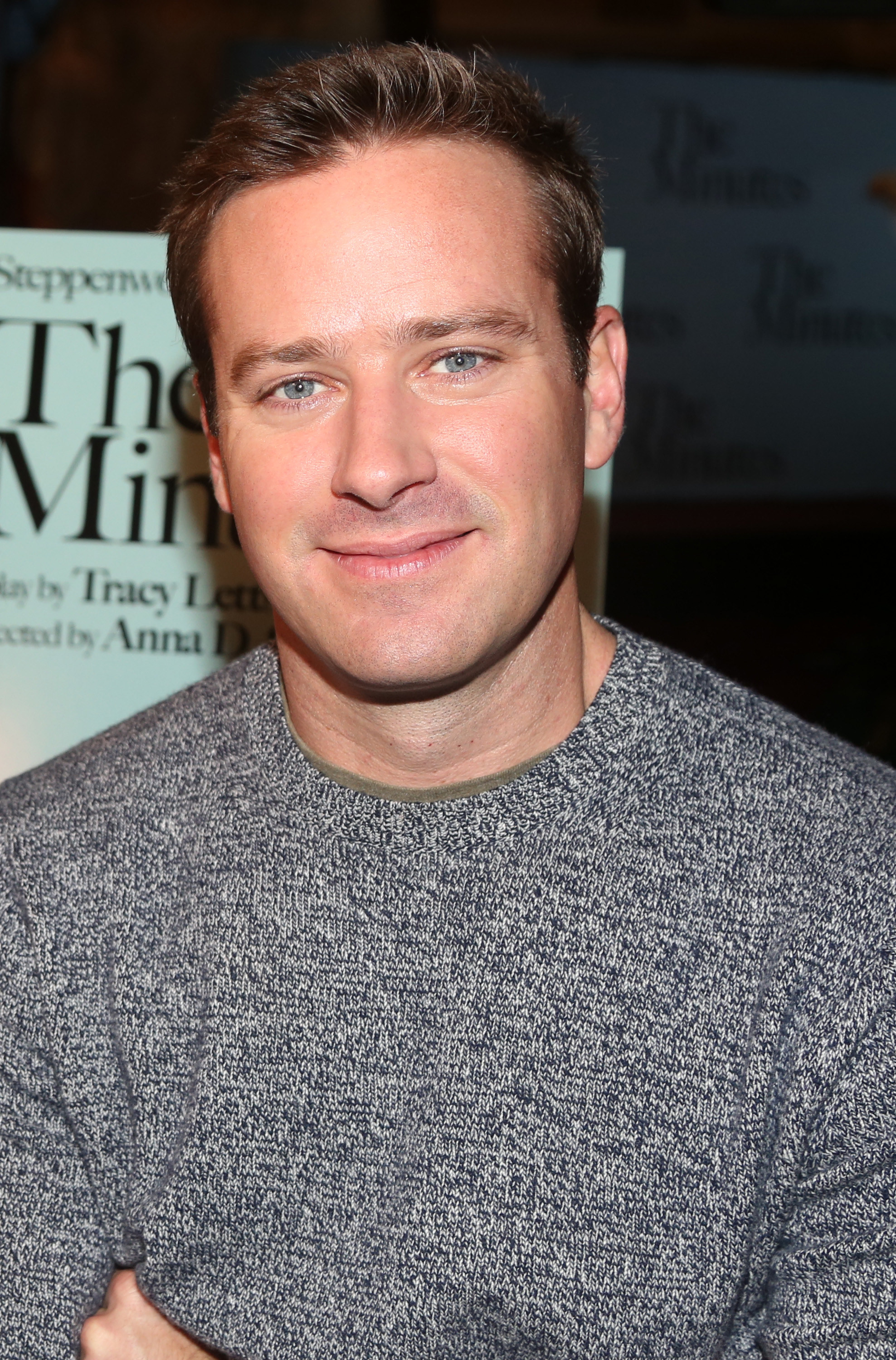 Hammer smiles while wearing a sweater at a press day for the play The Minutes