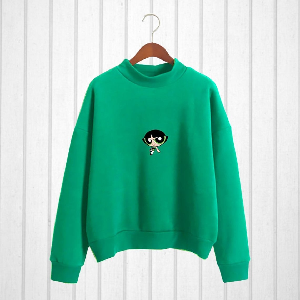 A vibrant crew neck sweater with an image of Buttercup on the front
