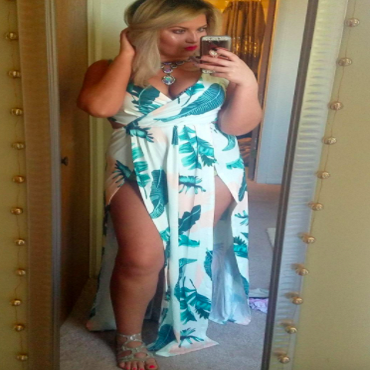 A customer review photo of them taking a mirror selfie in the dress