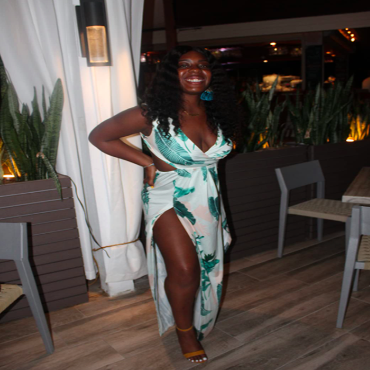 A customer review photo of them wearing the dress on vacation