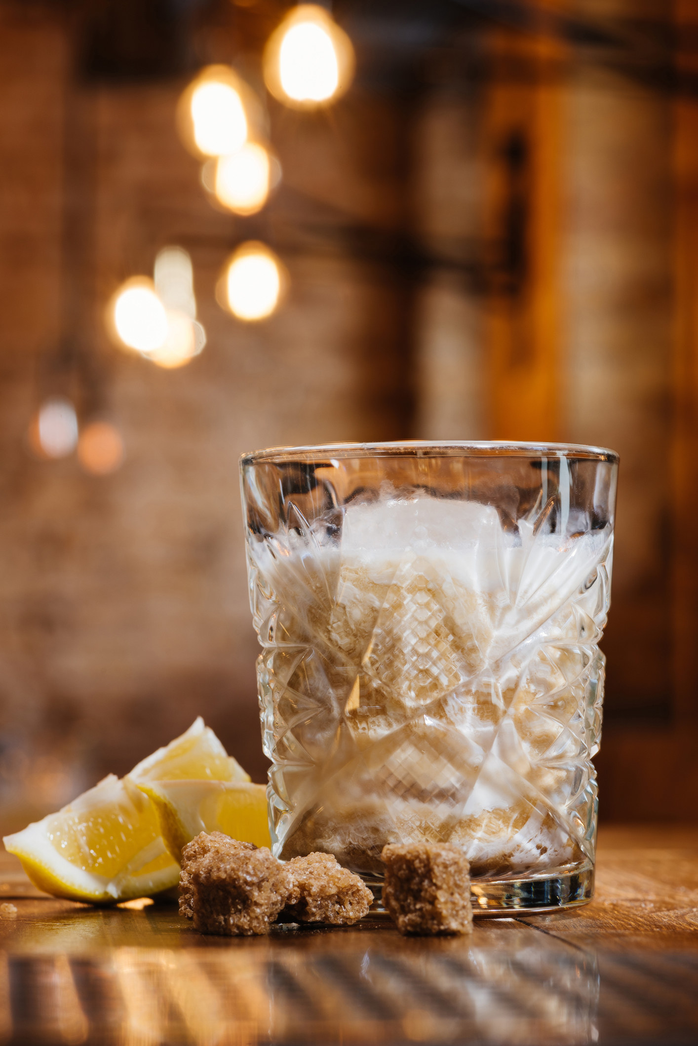 White Russian drink in a short glass with slices of lemon